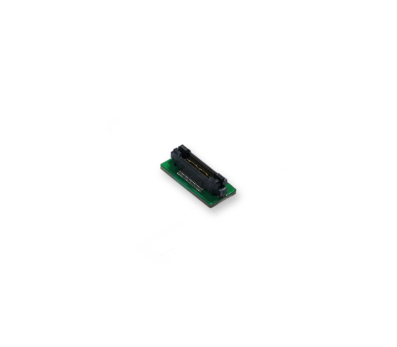 A small green electronic circuit board with a connector. The board has two black socket connectors at the top and a row of metallic pins along the bottom. This component is typically used for connecting electronic devices.